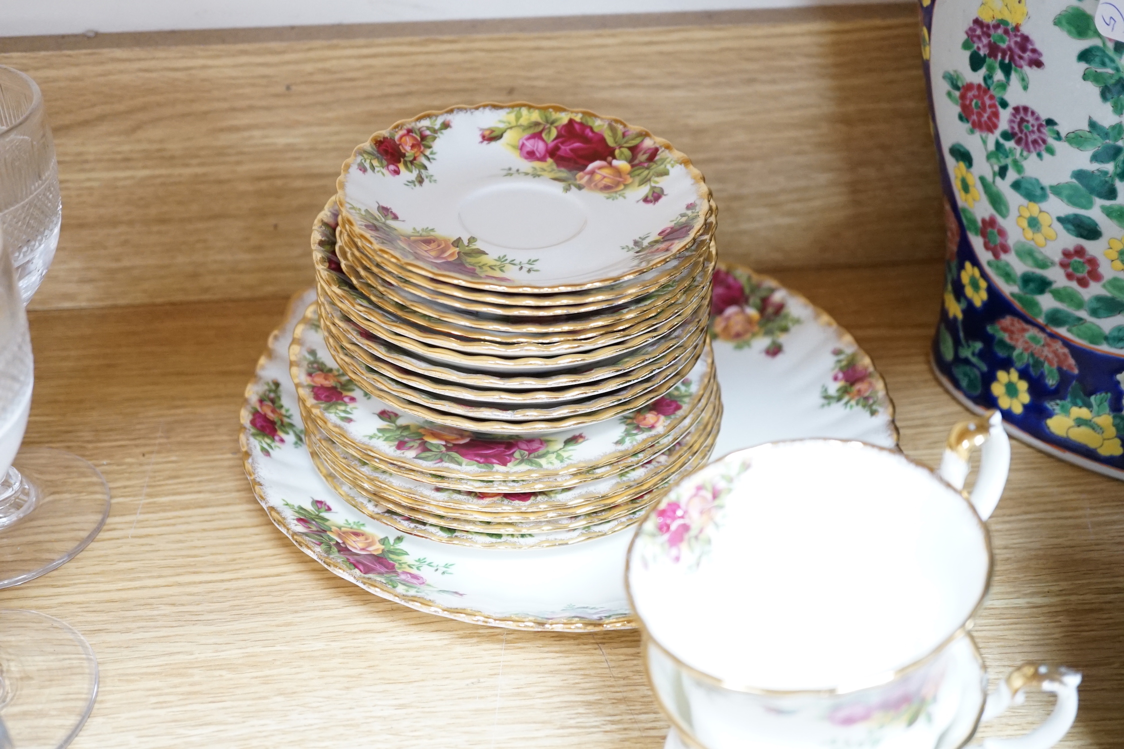 A quantity of Royal Albert old country roses pattern teawares including teapot, various cups and saucers, side plates, cake stand, coffee, pot, quartz, clock, sugar bowl, trays, etc.